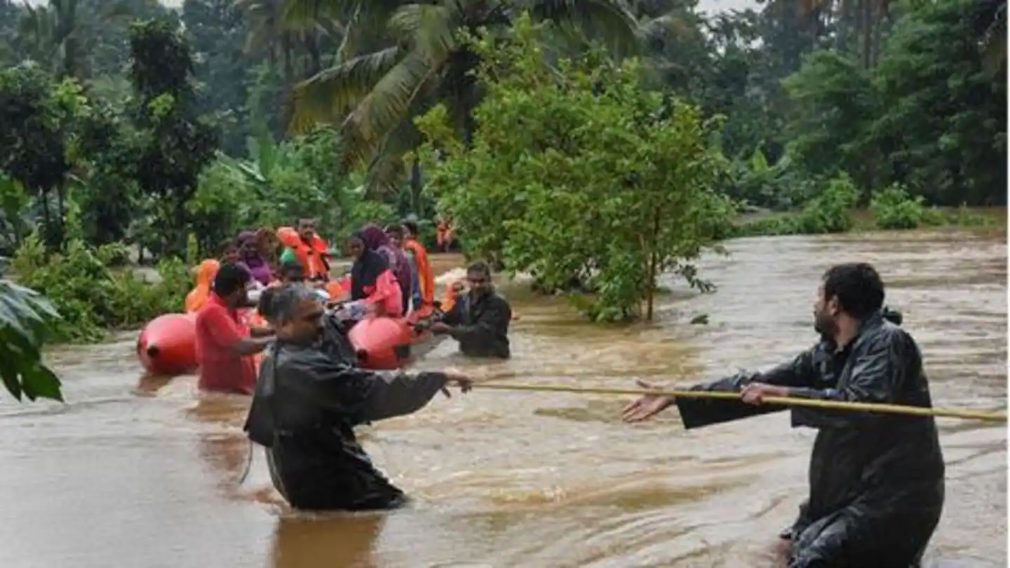 Rescue volunteers helping flood-affected residents to safety